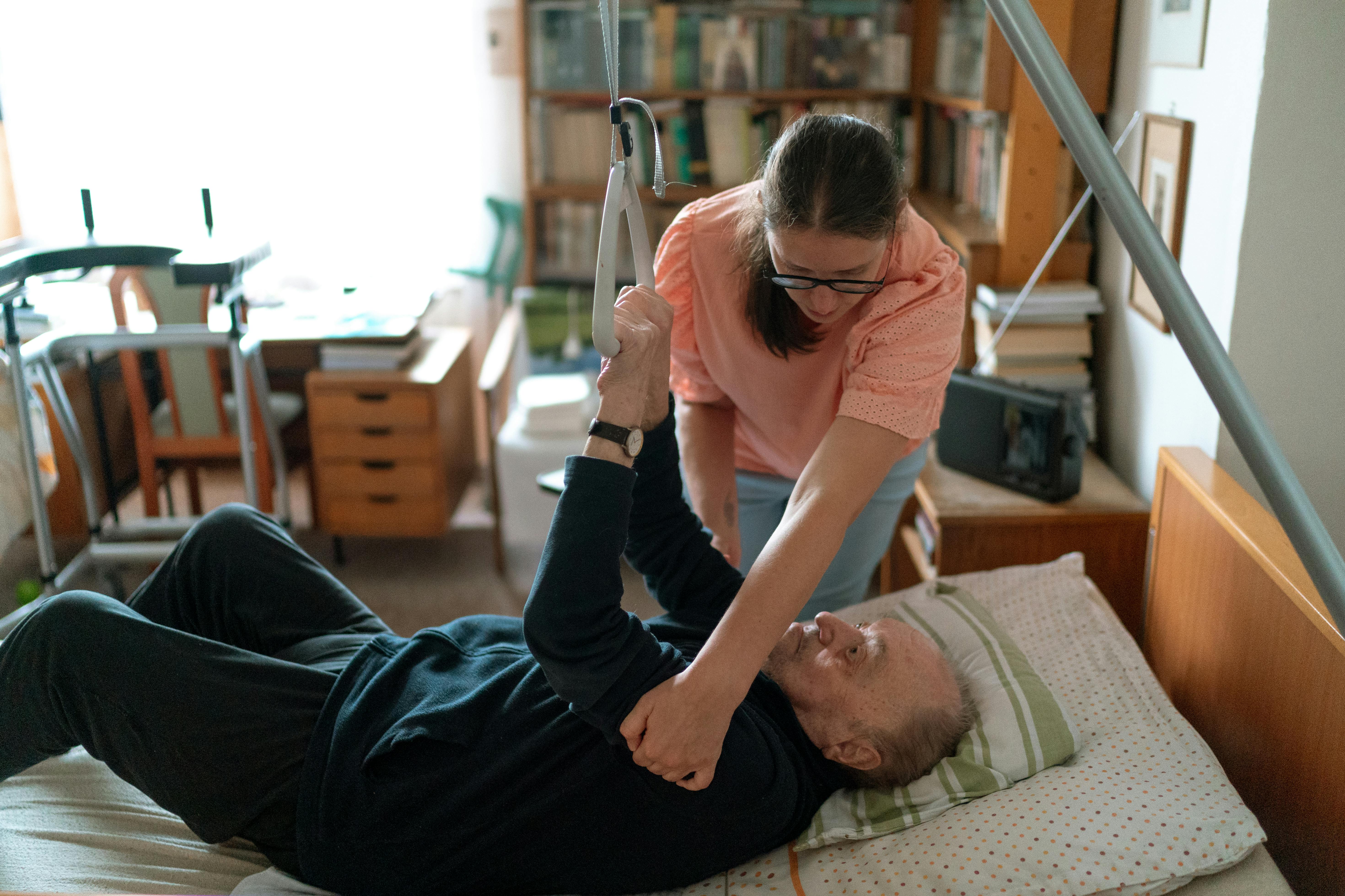 Support worker assisting a client with mobility
